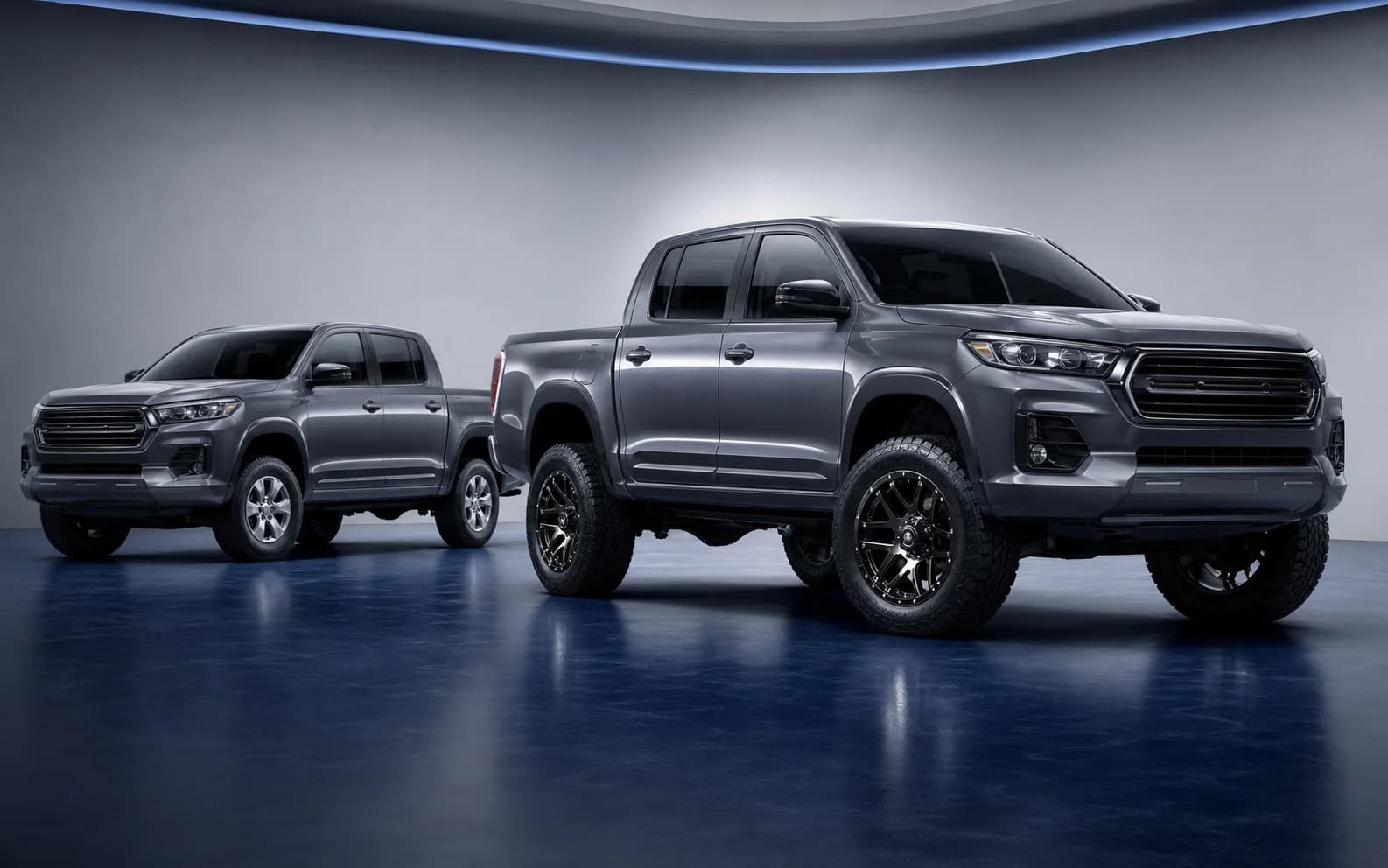 Factory and lifted versions of the same pickup in an automotive studio